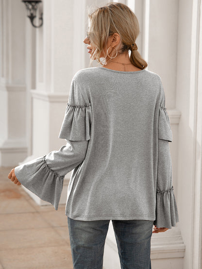 Blusa de manga larga con volantes en el pecho