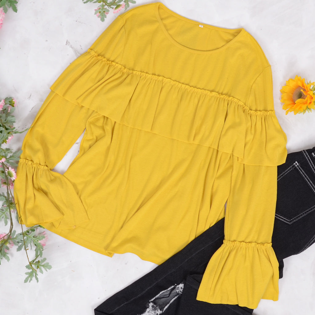 Blusa de manga larga con volantes en el pecho