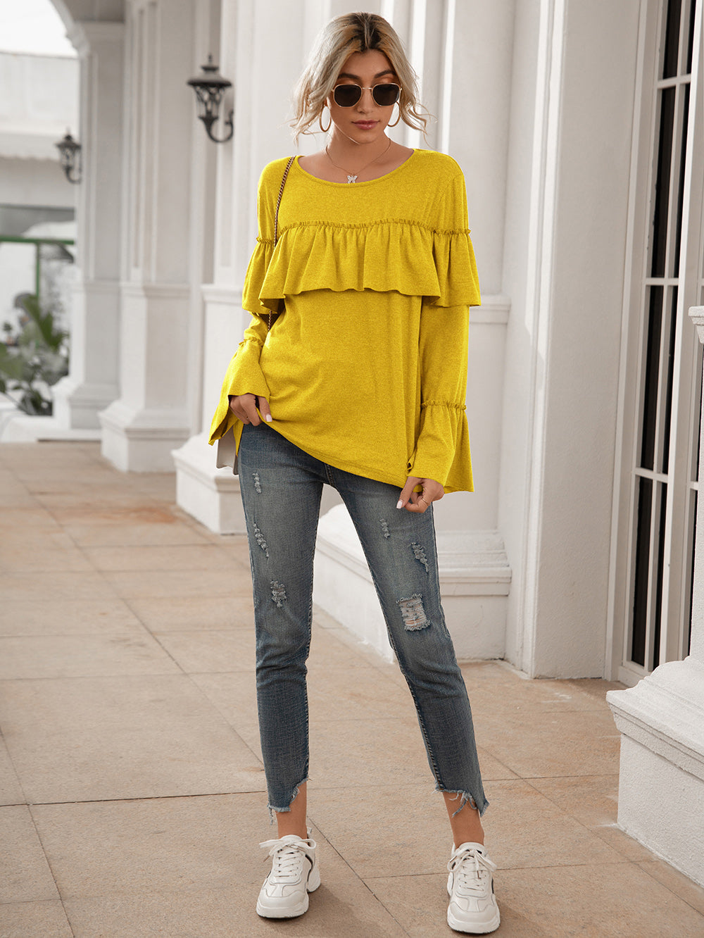 Blusa de manga larga con volantes en el pecho