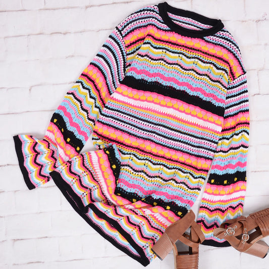 Vestido tipo suéter de punto con un toque festivo y vibrante
