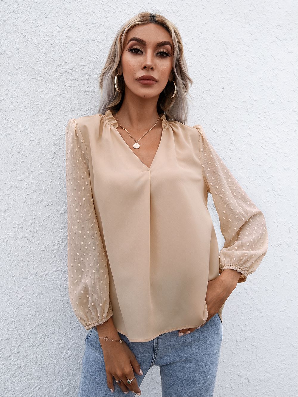 Blusa de manga larga con lunares y campana Clip