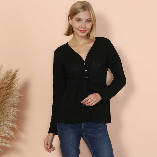 Blusa peplum con volantes y botones en la parte delantera