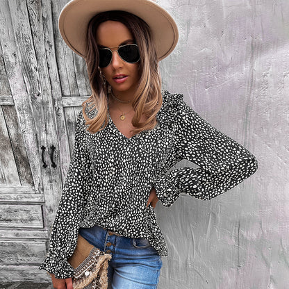 Blusa con volantes en los hombros y estampado animal 