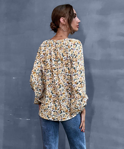 Blusa vintage con cuello en V y estampado floral