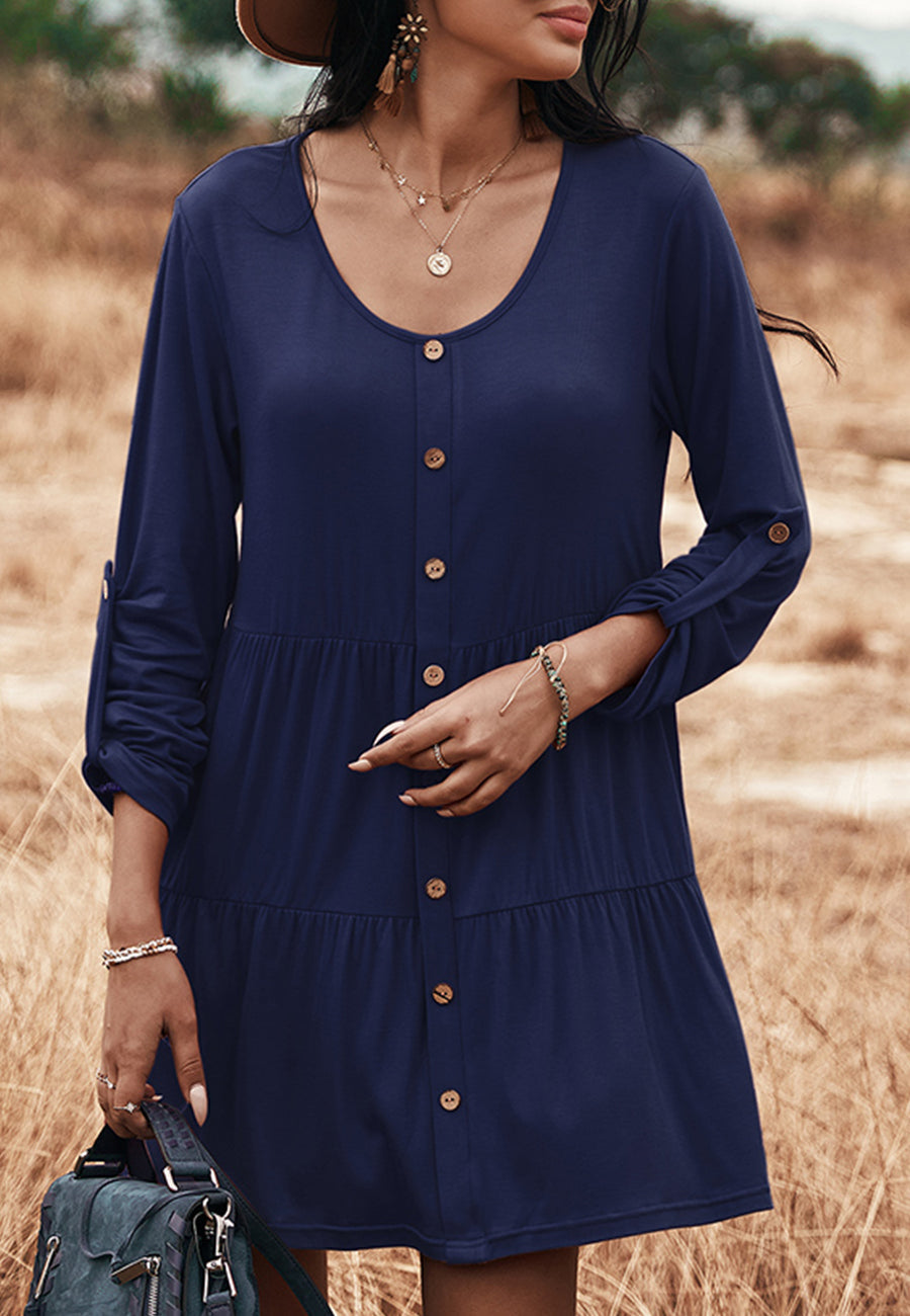 Vestido recto con botones y capas 