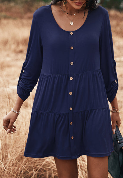 Vestido recto con botones y capas 