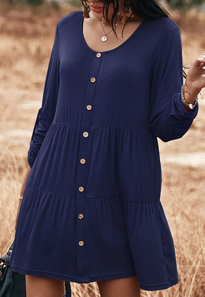 Vestido recto con botones y capas 