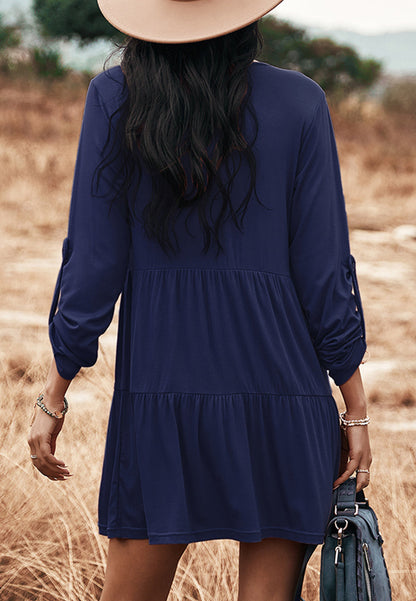 Vestido recto con botones y capas 