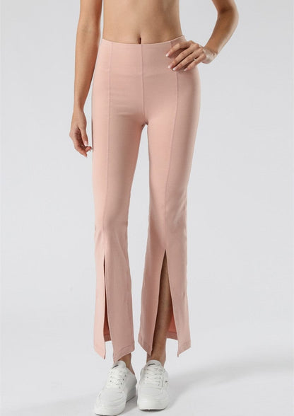 Pantalones acampanados de cintura media con aberturas en el centro delantero