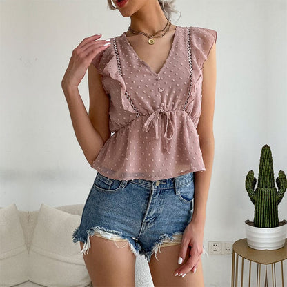 Blusa peplum con volantes y lunares suizos