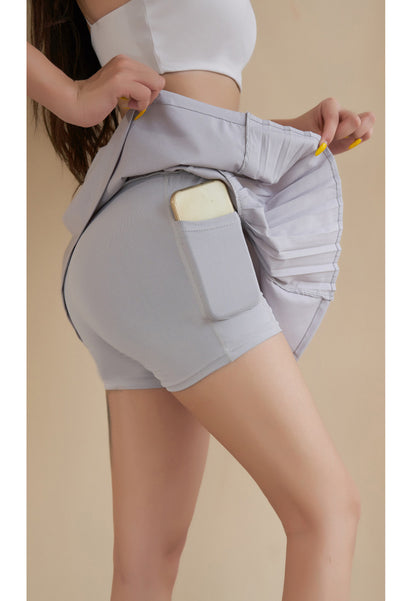 Falda deportiva con cintura elástica y laterales con volantes