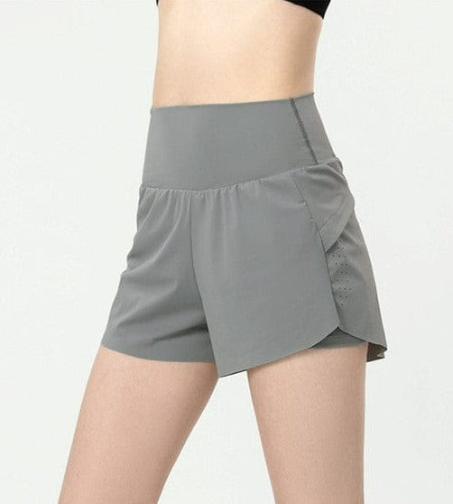 Pantalones cortos deportivos relajados con doble forro