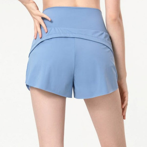 Pantalones cortos deportivos relajados con doble forro