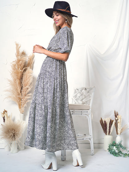 Vestido cruzado con mangas abullonadas y estampado 