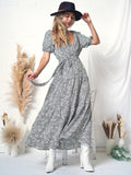 Vestido cruzado con mangas abullonadas y estampado 