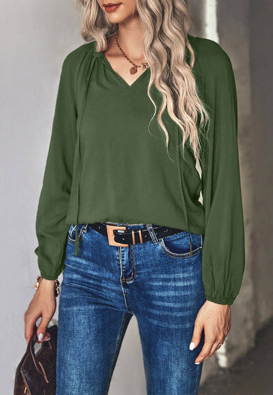 Blusa clásica con lazo en el cuello