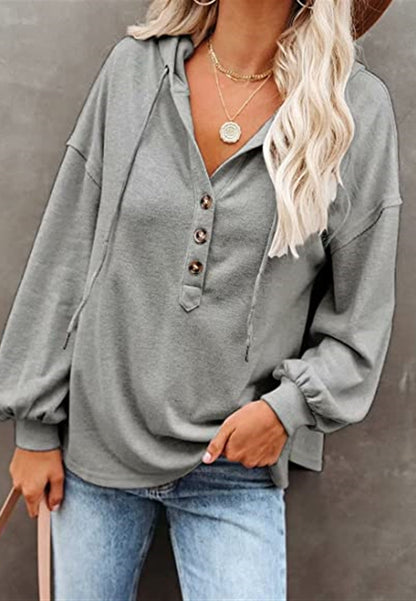 Sudadera con capucha y detalle de botones