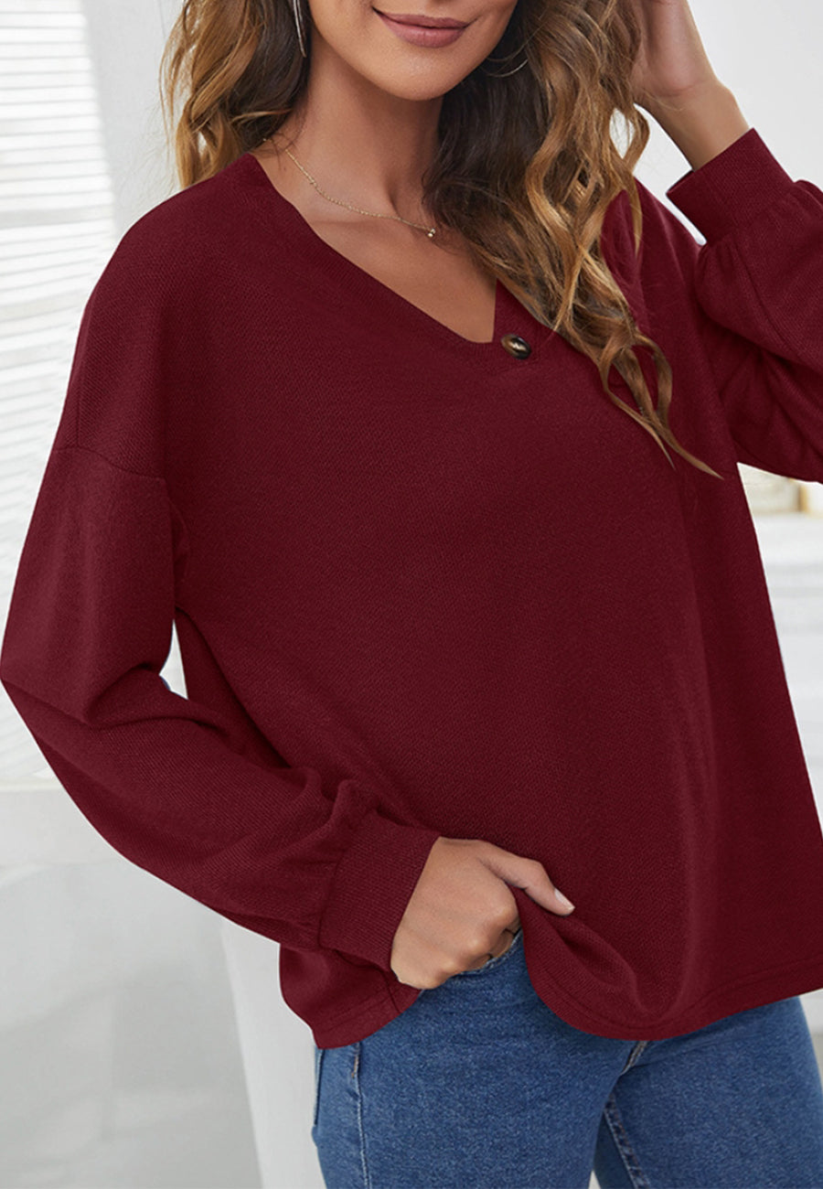 Suéter con detalle de botones en contraste liso