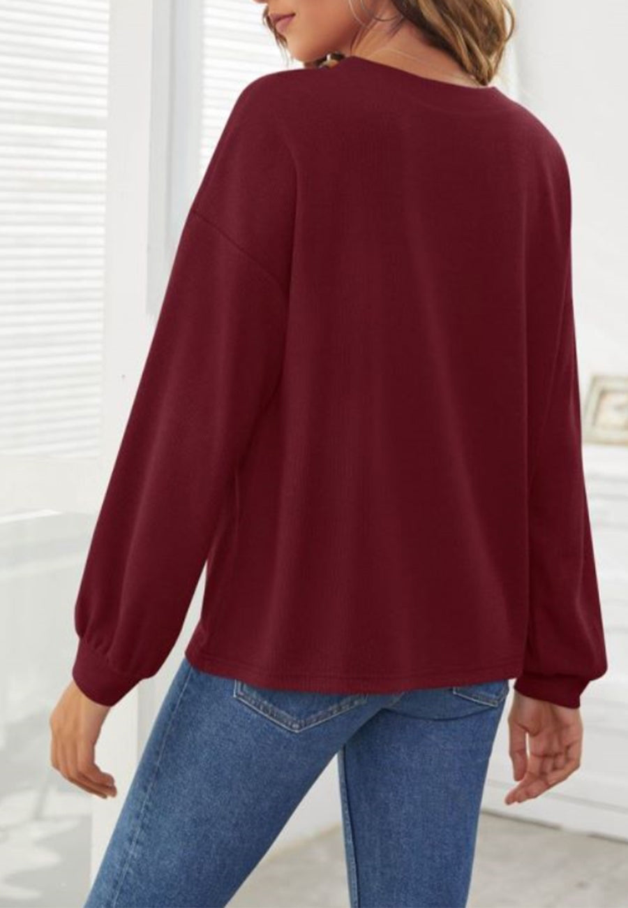 Suéter con detalle de botones en contraste liso