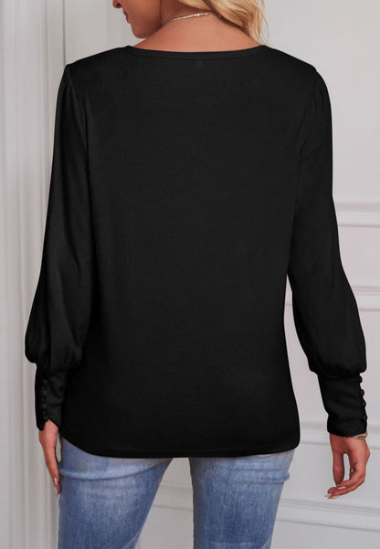 Blusa con puños abotonados en color liso 