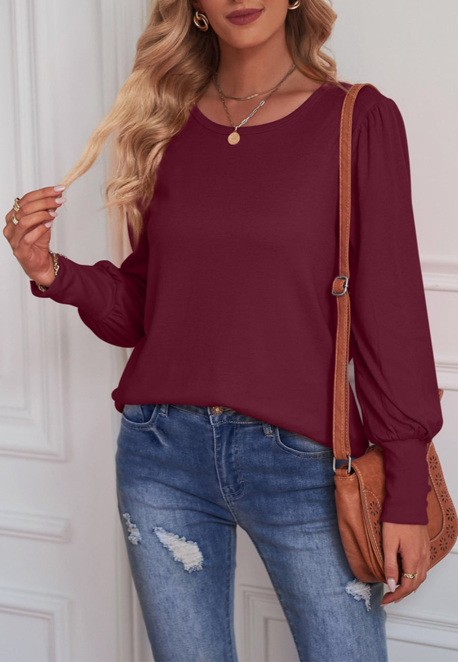 Blusa con puños abotonados en color liso 
