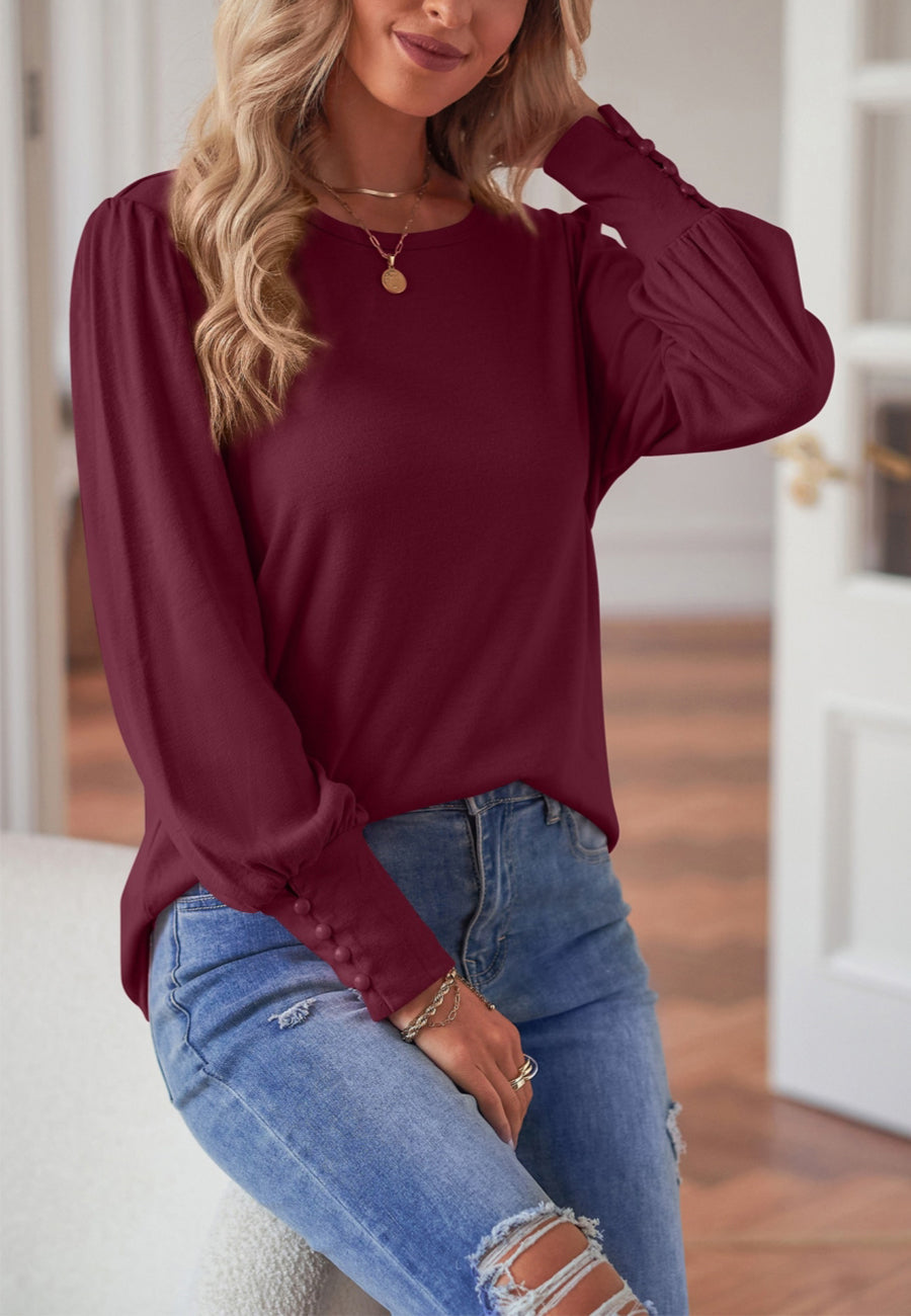 Blusa con puños abotonados en color liso 