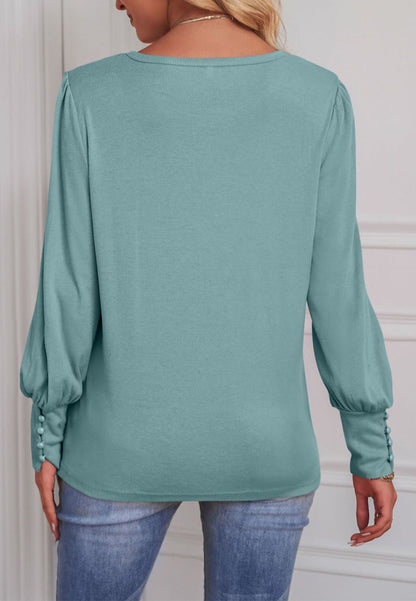 Blusa con puños abotonados en color liso 