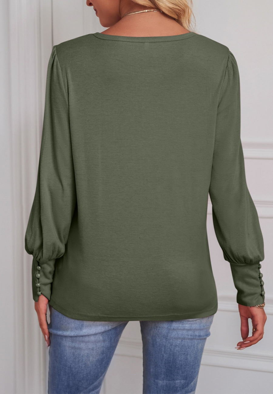 Blusa con puños abotonados en color liso 