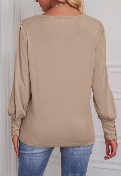 Blusa con puños abotonados en color liso 