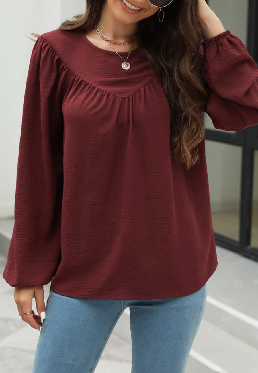Blusa con volantes en forma de V 