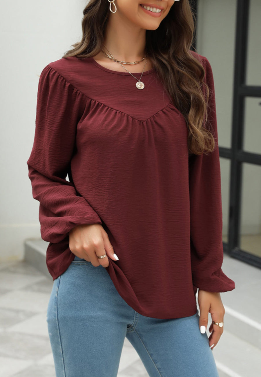 Blusa con volantes en forma de V 