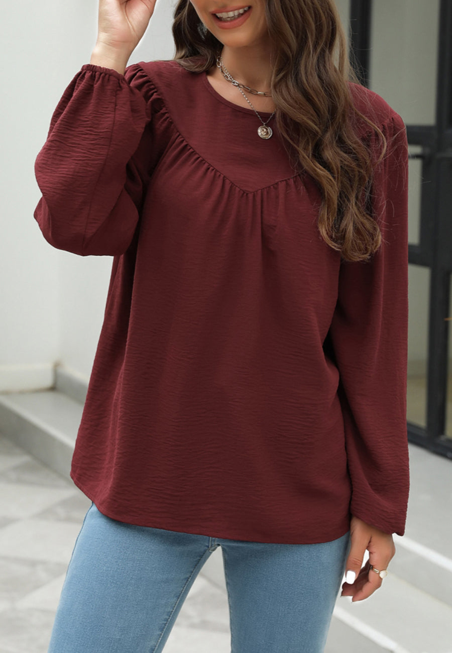 Blusa con volantes en forma de V 