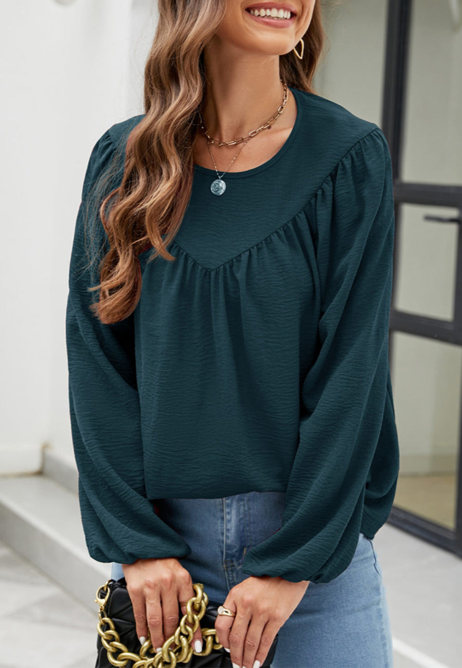 Blusa con volantes en forma de V 