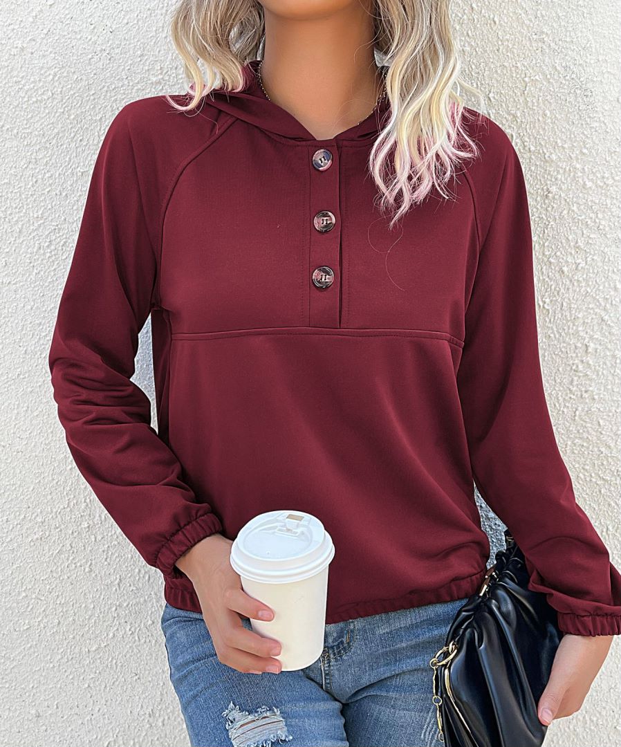 Sudadera con capucha y medio botón 