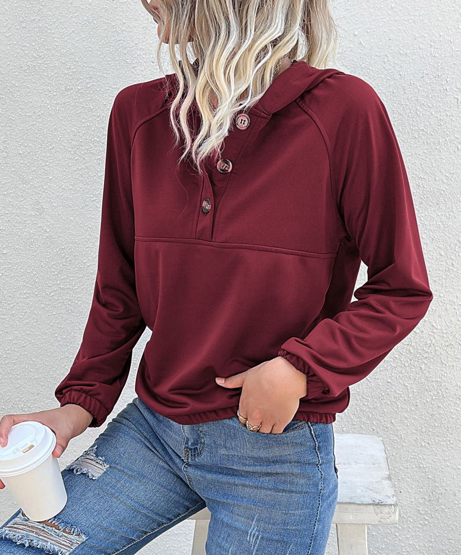 Sudadera con capucha y medio botón 