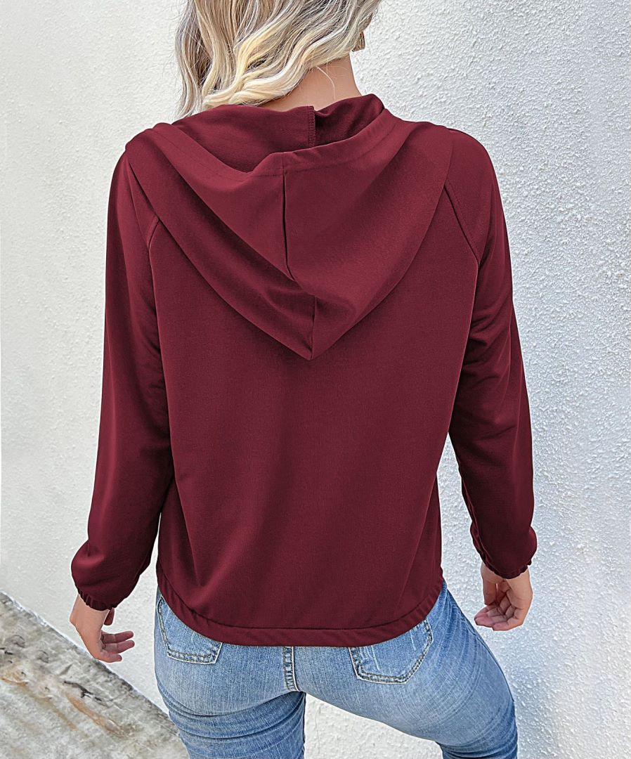 Sudadera con capucha y medio botón 