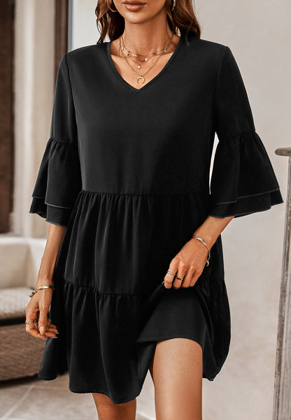 Vestido con mangas con volantes y capas de color liso 