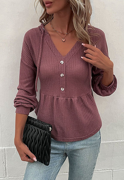 Suéter de punto peplum con capucha