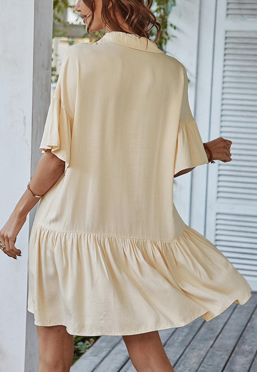 Vestido asimétrico con volantes y botones