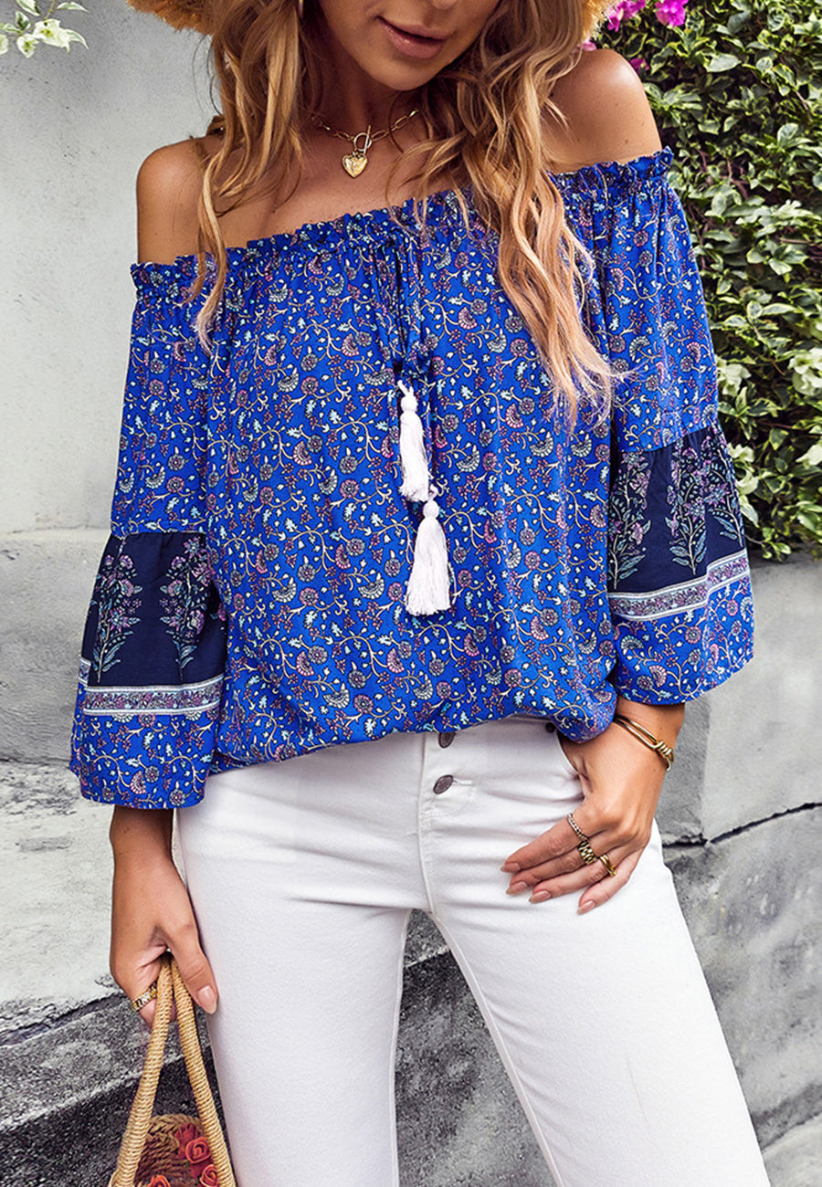 Blusa con borlas y hombros descubiertos