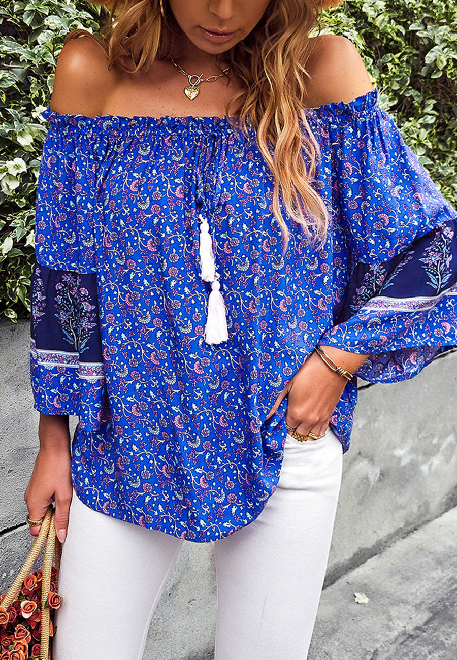 Blusa con borlas y hombros descubiertos