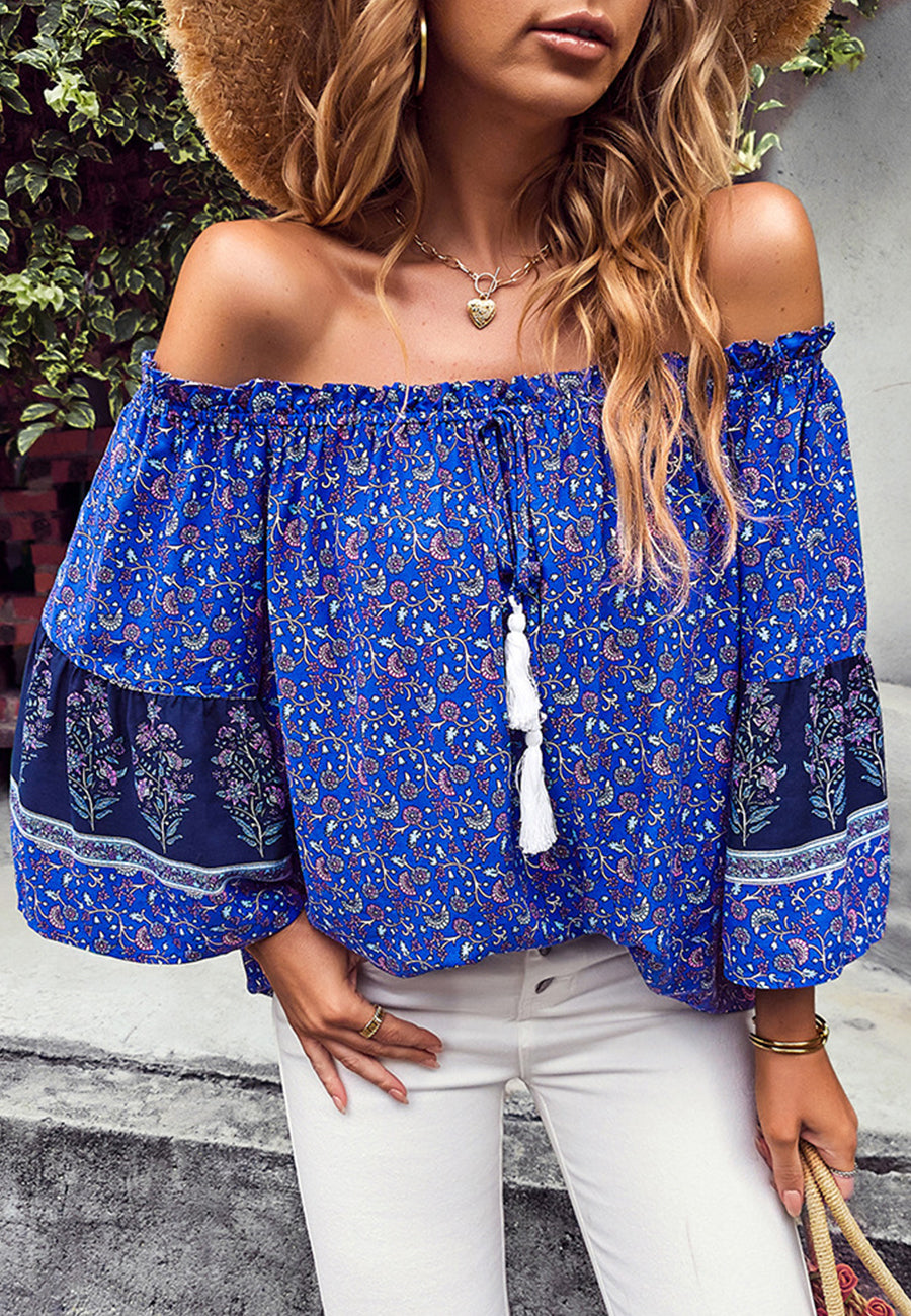 Blusa con borlas y hombros descubiertos