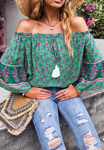 Blusa con borlas y hombros descubiertos