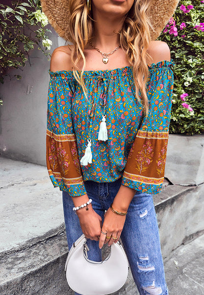 Blusa con borlas y hombros descubiertos