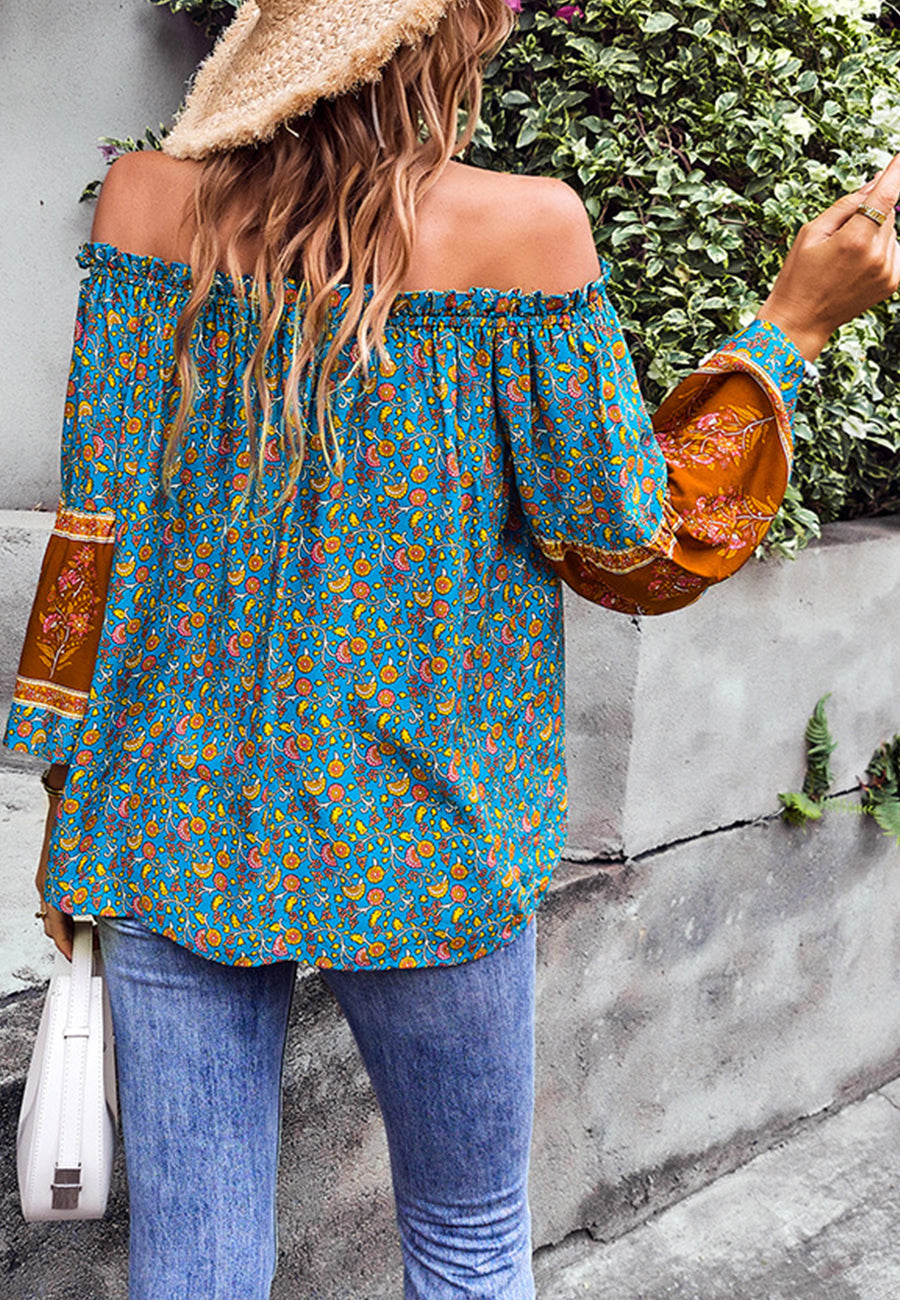 Blusa con borlas y hombros descubiertos