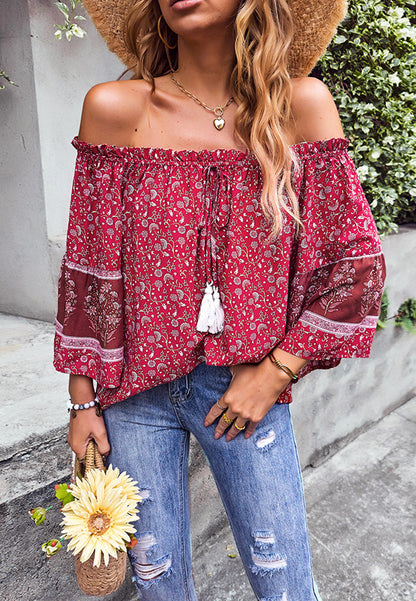 Blusa con borlas y hombros descubiertos