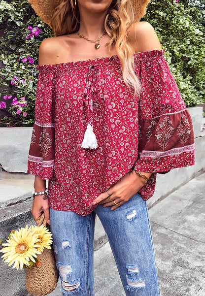 Blusa con borlas y hombros descubiertos