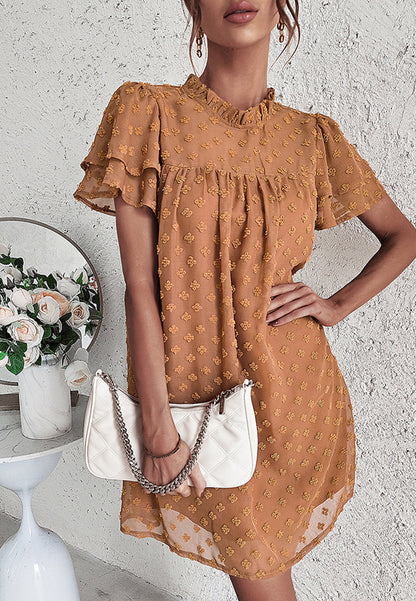 Vestido con mangas abullonadas y capas