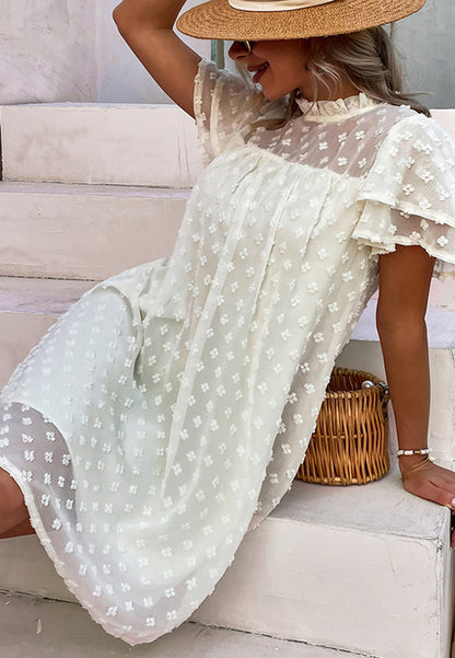 Vestido con mangas abullonadas y capas