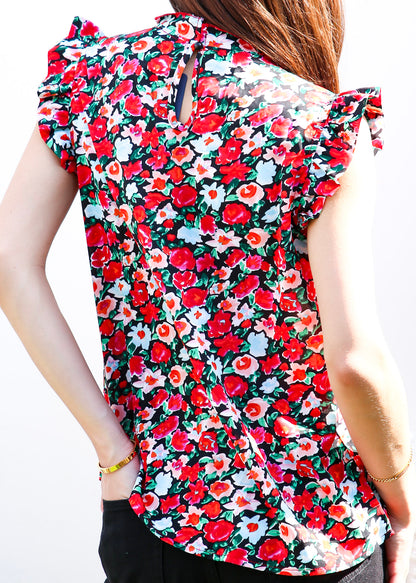 Blusa con detalle de volante y estampado floral